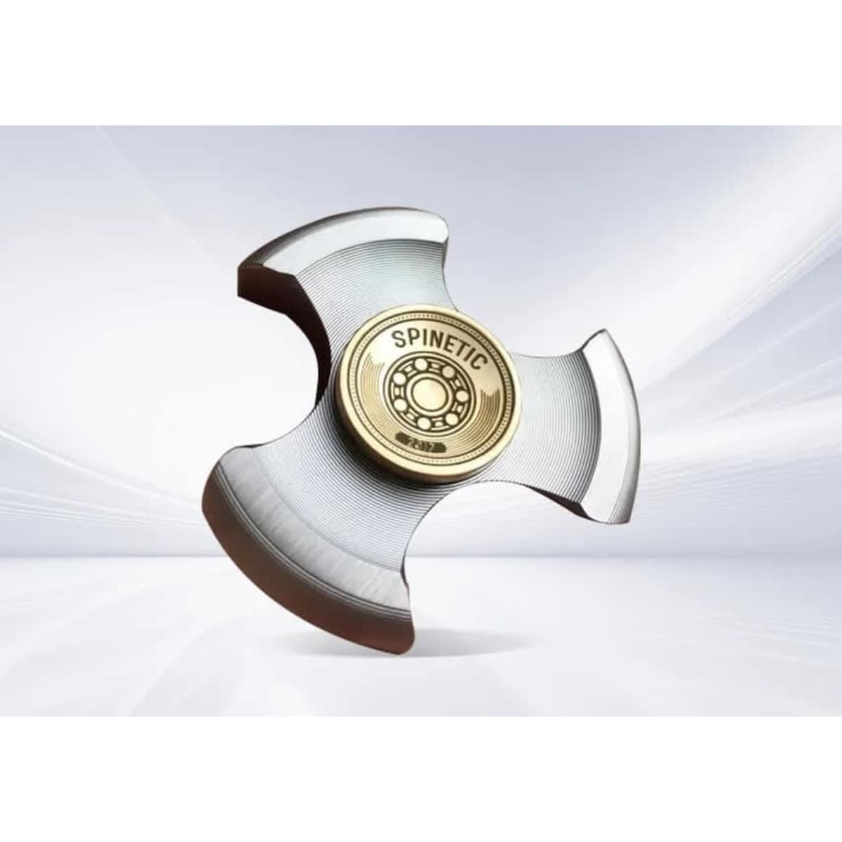 A die struck fidget spinner in metallic grey and gold, featuring a central logo and sleek design.