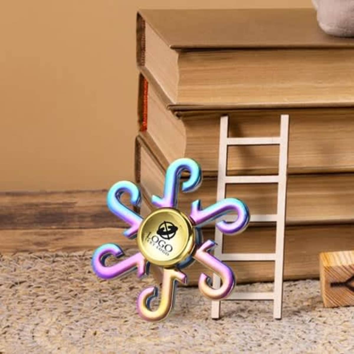 A rainbow fidget spinner with a stylish design, featuring a central logo and vibrant, iridescent colours.