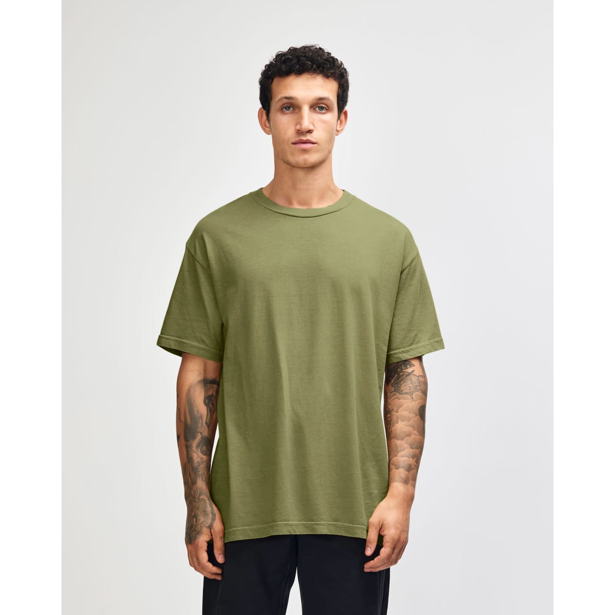 A unisex heavyweight cotton t-shirt in olive green, featuring a relaxed fit and short sleeves. It includes a logo.