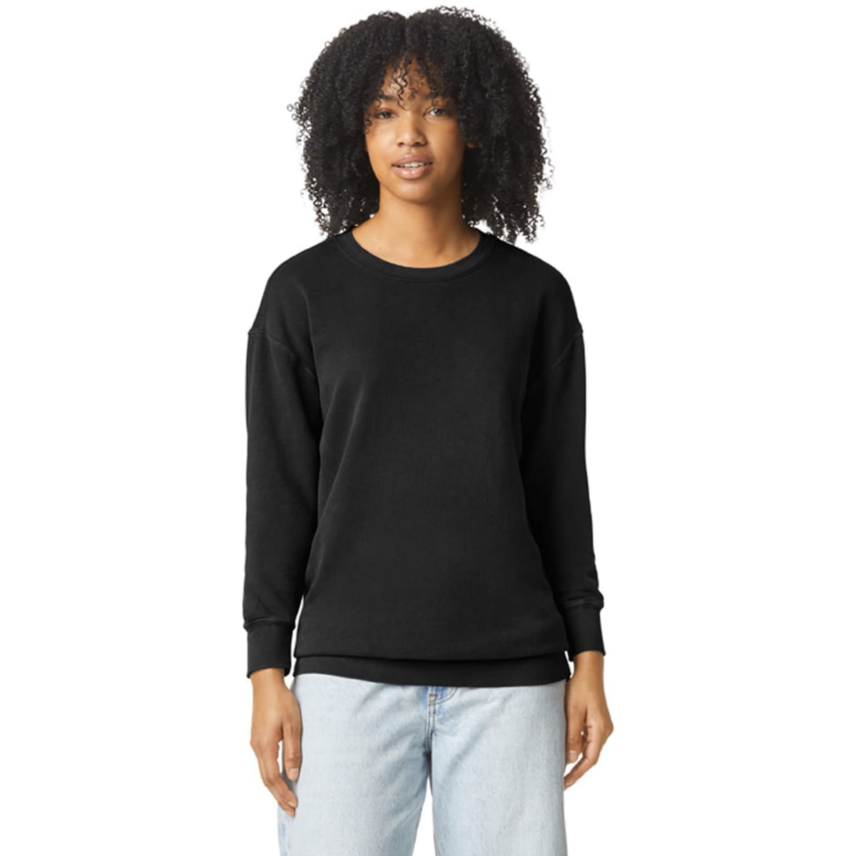 A black lightweight crewneck sweatshirt with long sleeves, featuring a logo, styled on a model.