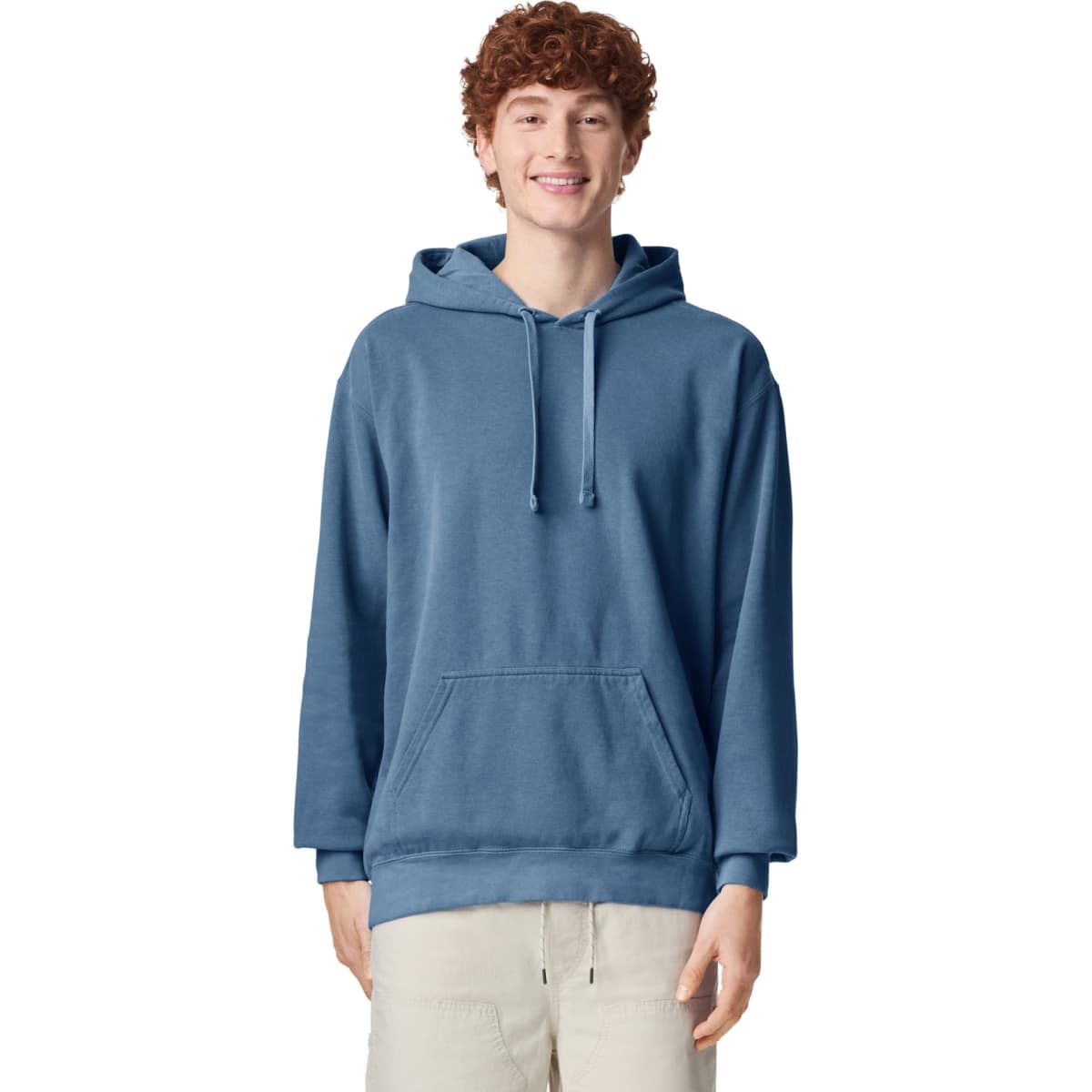 A blue adult hooded sweatshirt featuring a front pouch pocket and a logo, worn by a smiling model.
