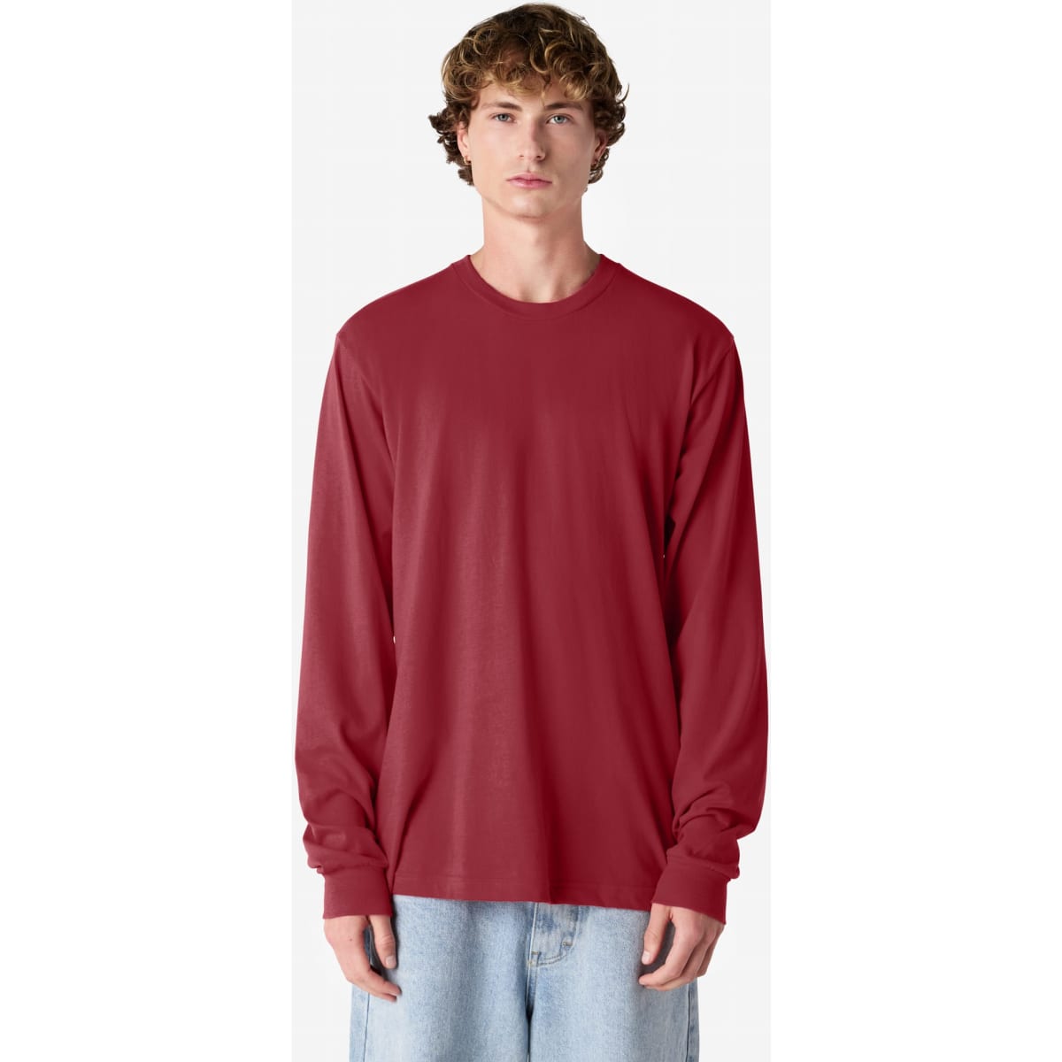A red long sleeve T-shirt with a relaxed fit and a simple design, featuring a brand logo.