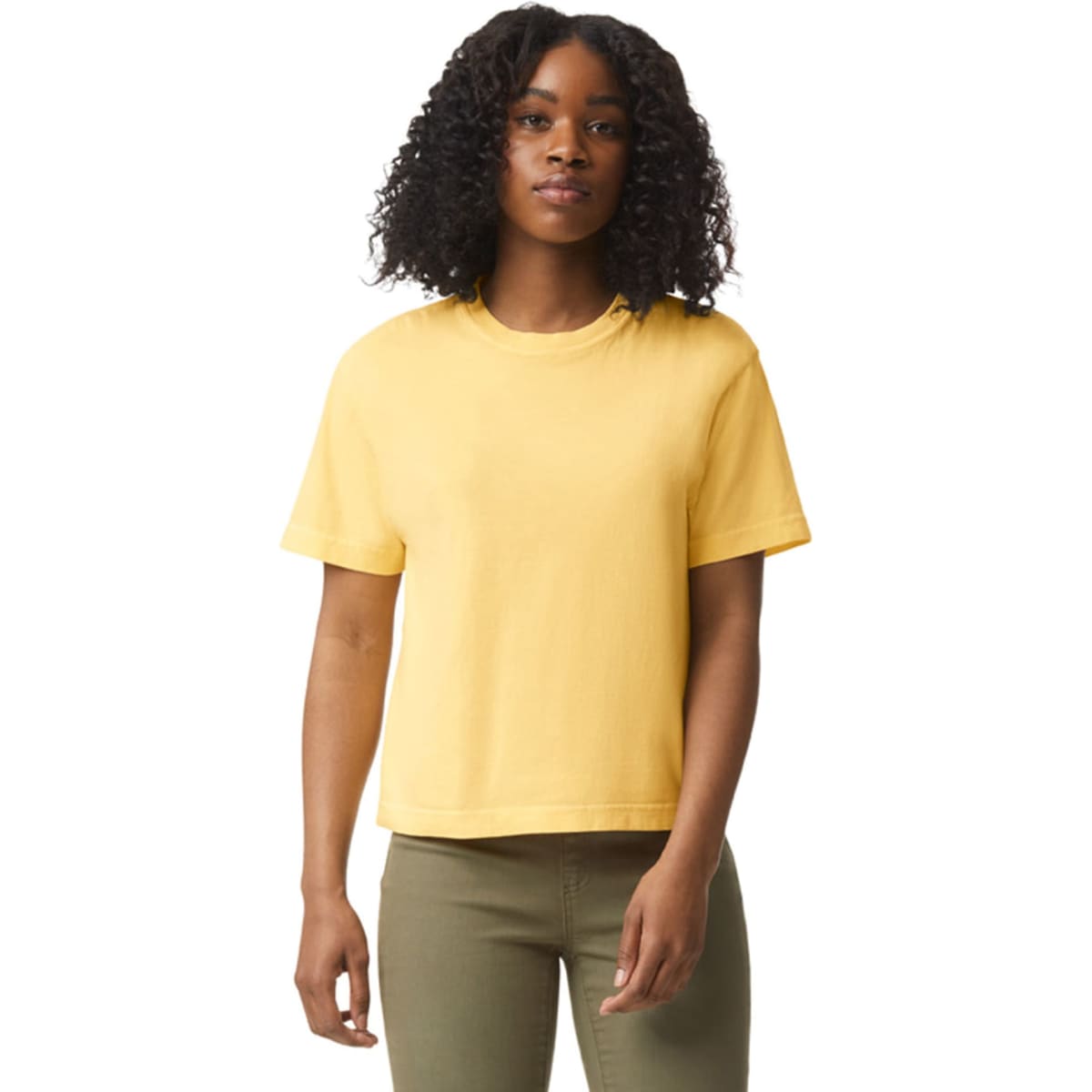 A boxy women's t-shirt in a vibrant yellow colour, featuring short sleeves and a relaxed fit.
