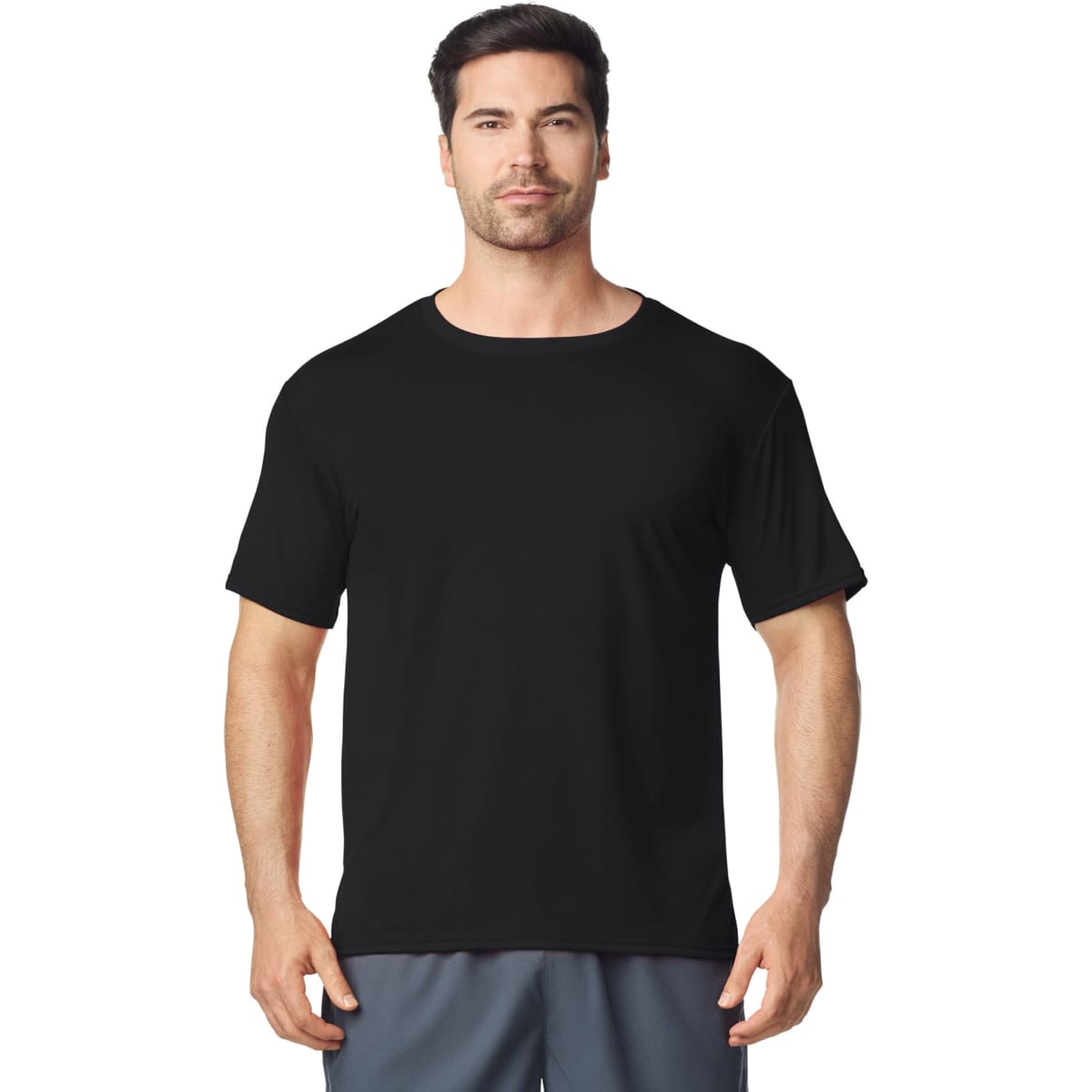 A black Gildan Performance adult T-shirt on a male model, featuring short sleeves and a round neckline.