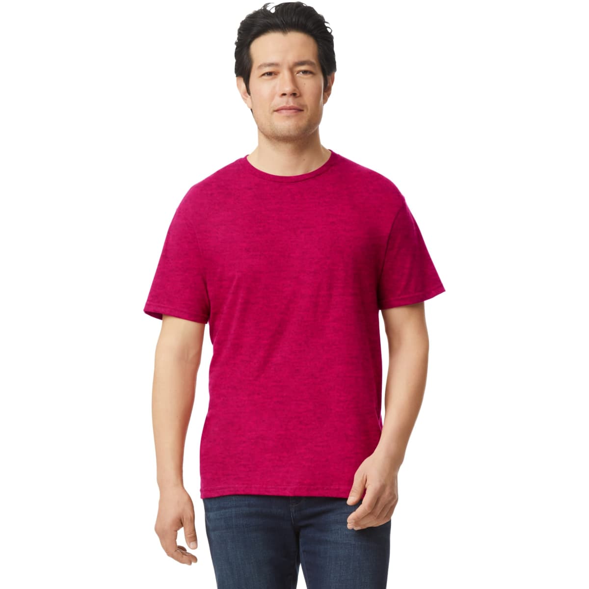 A man wearing a magenta Gildan Softstyle adult t-shirt, standing casually with a slight smile.