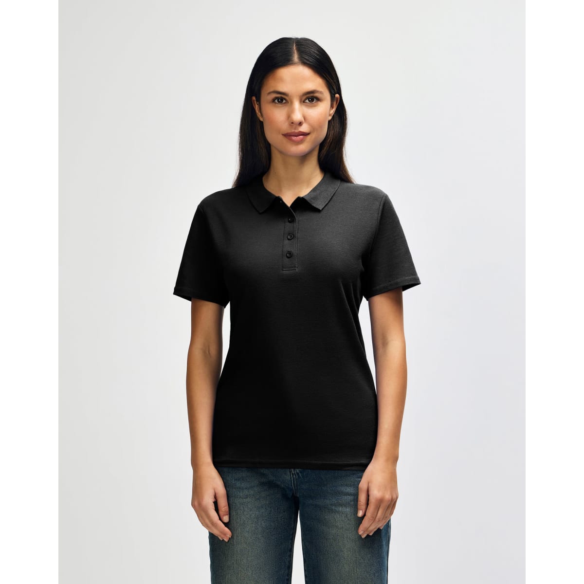 A black Gildan Softstyle ladies' double pique polo shirt with a logo, displayed on a model against a plain background.
