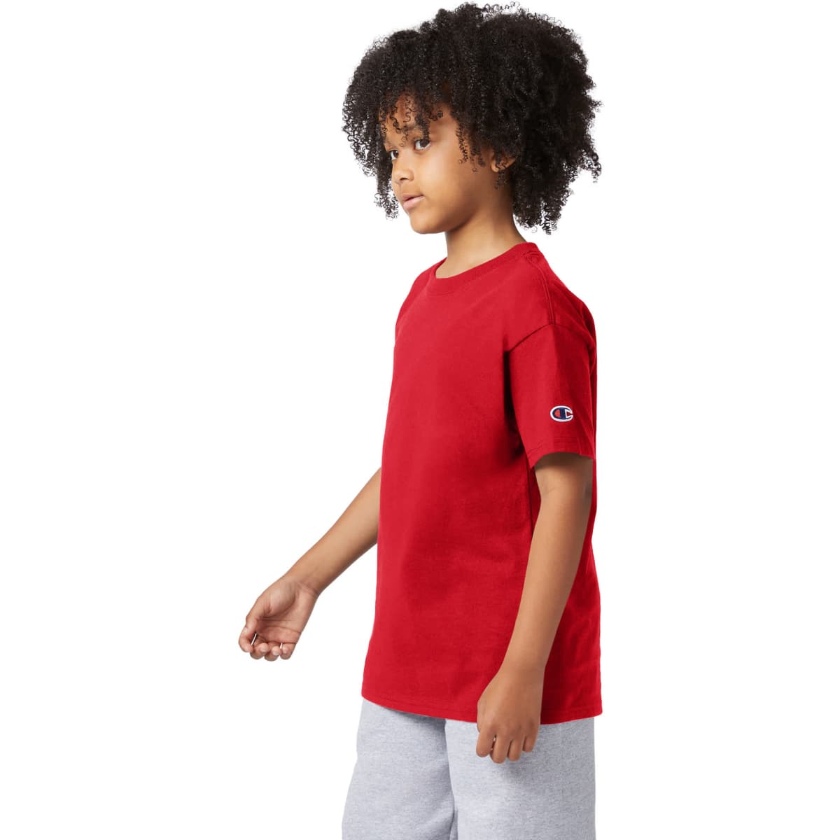 A red short sleeve t-shirt for youth, featuring a logo on one sleeve.