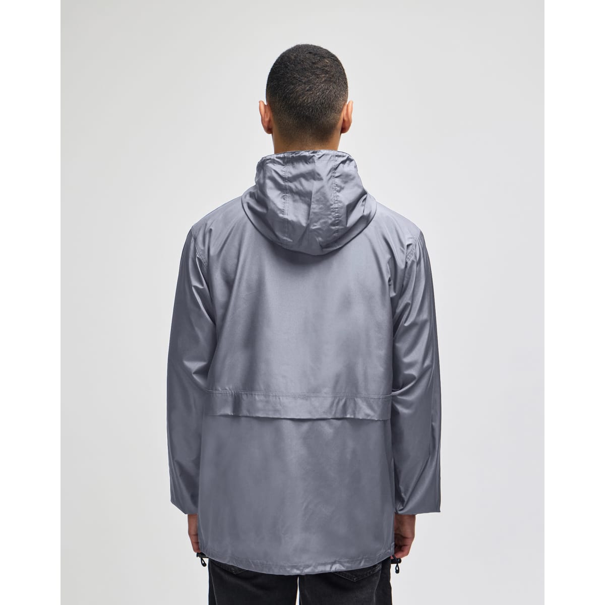 A man wearing a grey Champion Adult Full-Zip Anorak Jacket with a hood, viewed from the back.