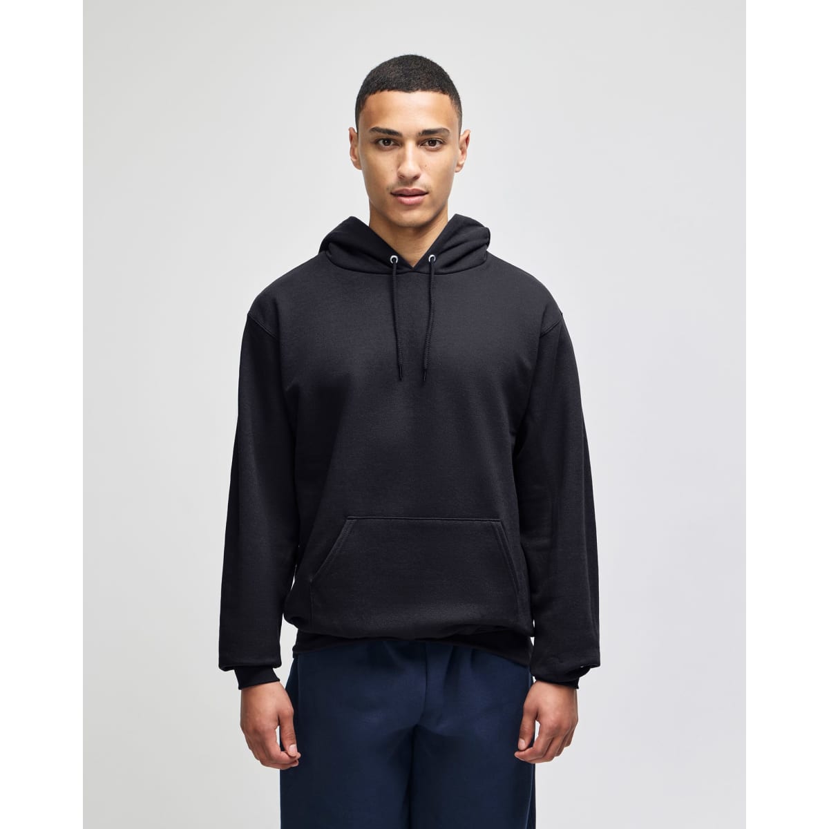 A black pullover hooded sweatshirt with a front pocket and an attached hood, featuring a logo.