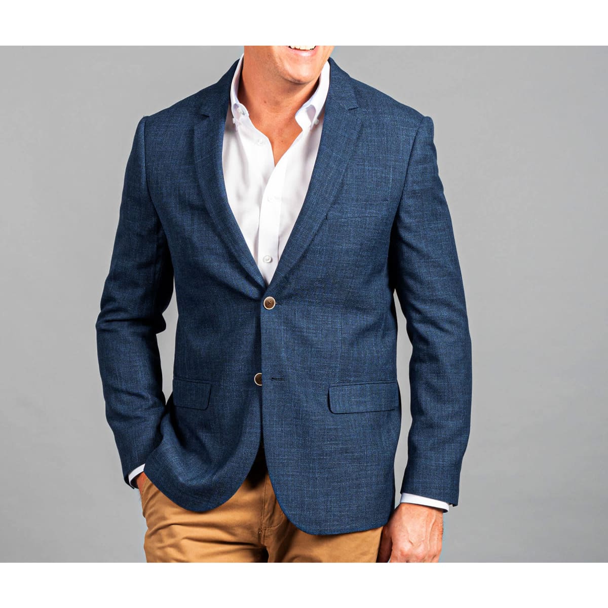 A blue blazer with a tailored fit, featuring two front pockets and a button closure.