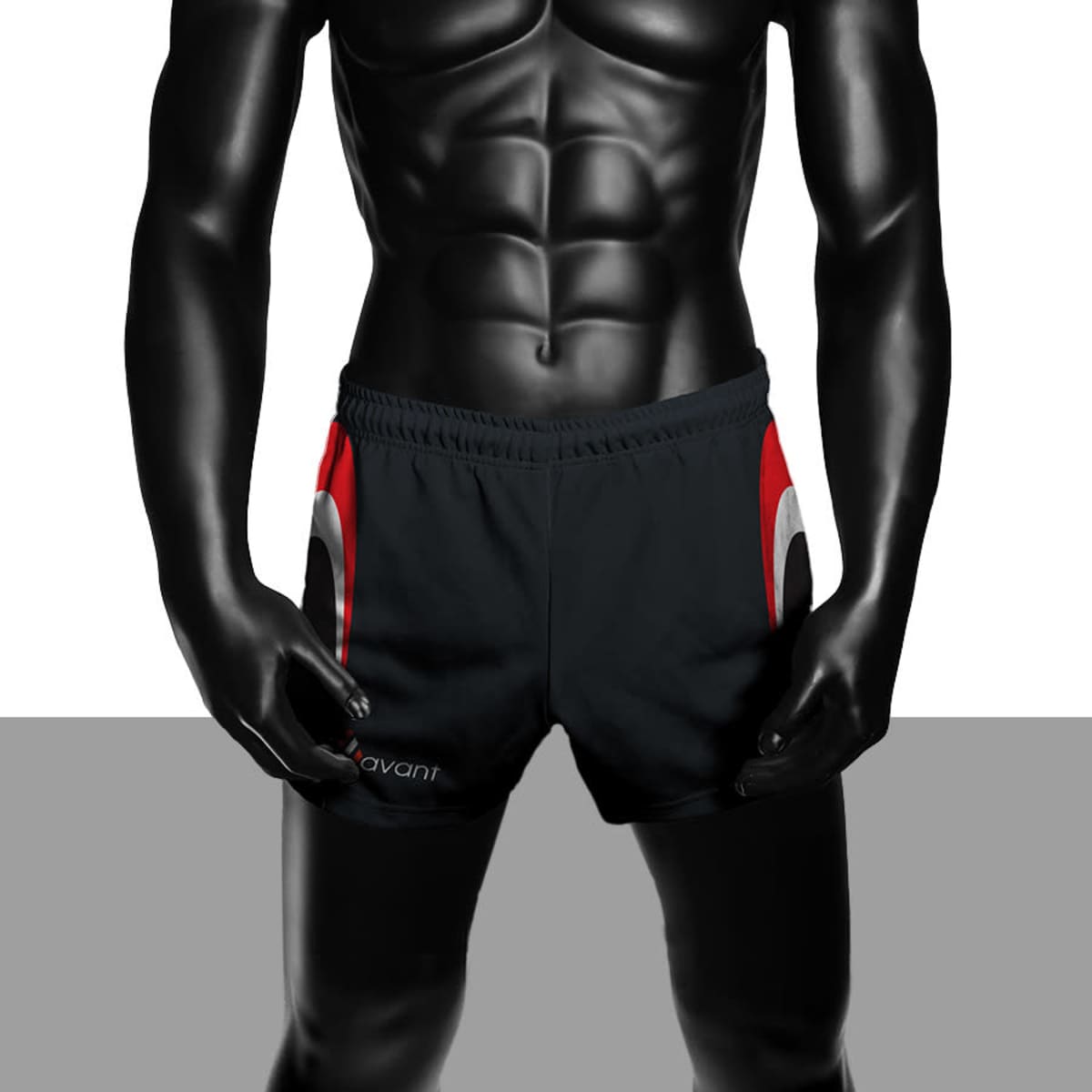 Sublimated sport shorts in black with red accents, featuring a logo on the lower side. Modelled on a mannequin.