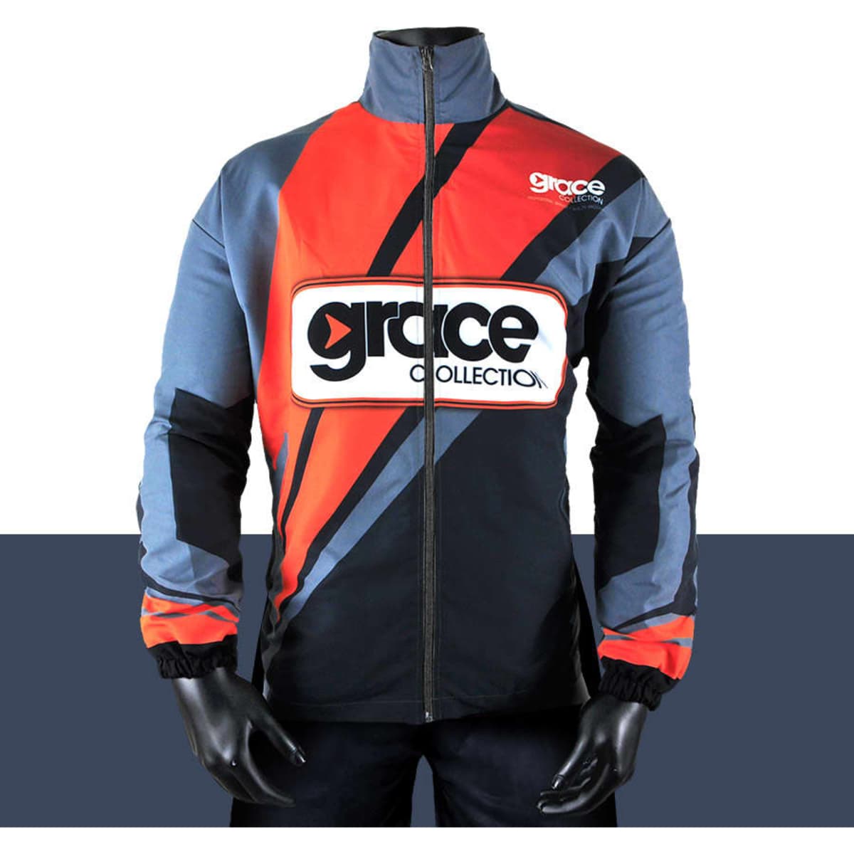 A track suit jacket featuring bold red, grey, and black colours, with a logo on the chest.