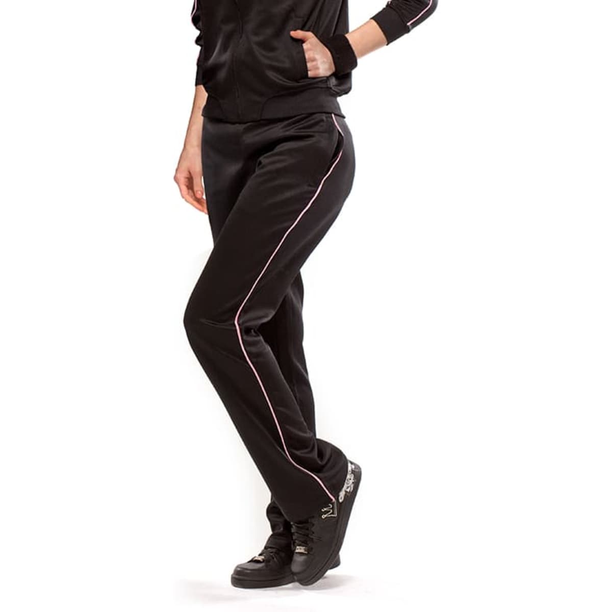 Black pants with pink side stripes, featuring a fitted design and an athletic style, worn by a model.