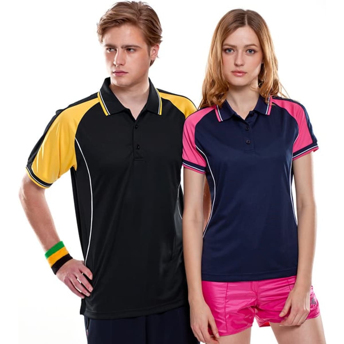 Two individuals wearing Avid Polos: one in a black and yellow polo, the other in a navy and pink polo.