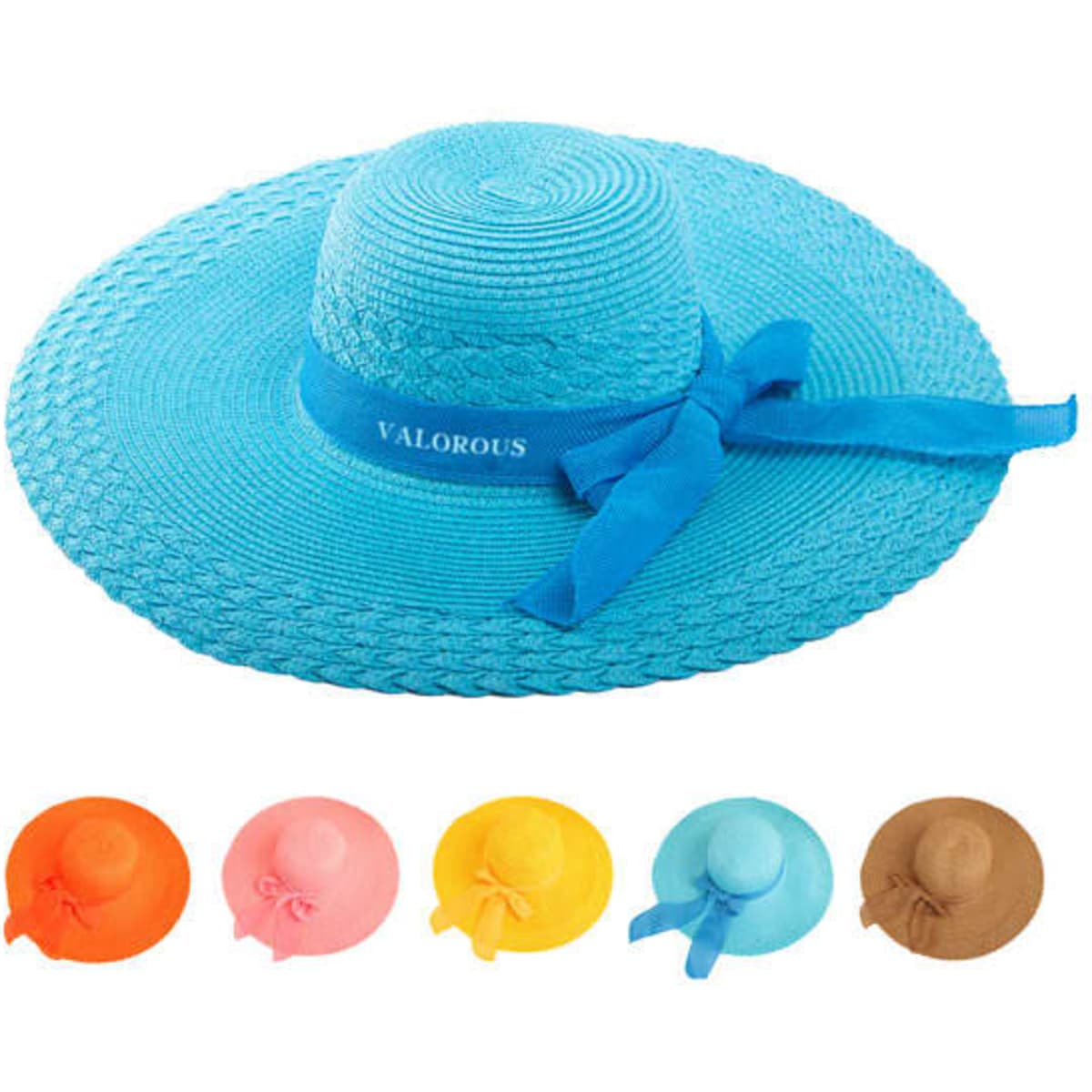 A wide-brimmed straw hat in turquoise with a blue bow. Additional hats in orange, pink, yellow, and brown are displayed.