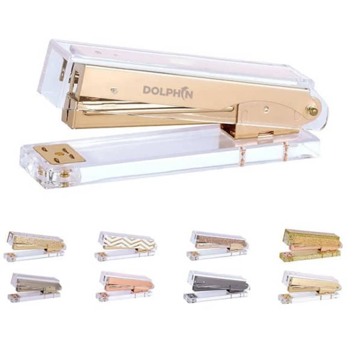 A clear acrylic stapler with rose gold tone accents, featuring various designs and colours in a display.