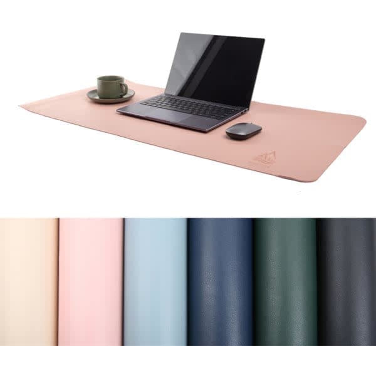 A large pink leather desk mat with a laptop, mouse, and drink cup, displayed alongside swatches of various colours.