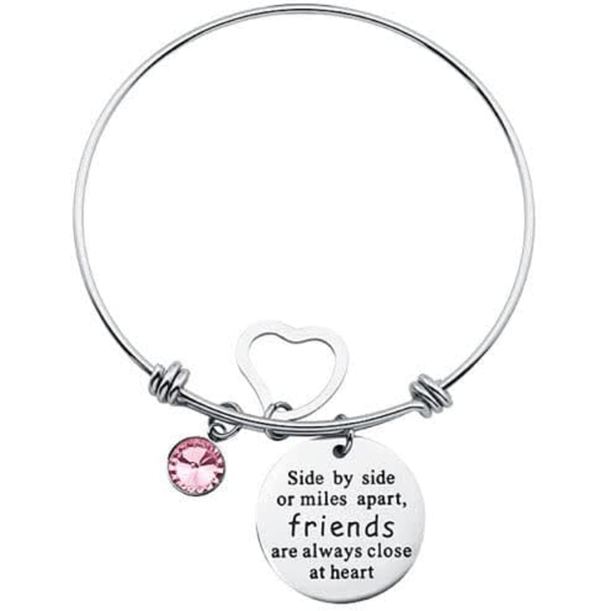 A silver adjustable charm bangle bracelet featuring a round charm and a pink gemstone. It has a heart-shaped clasp.