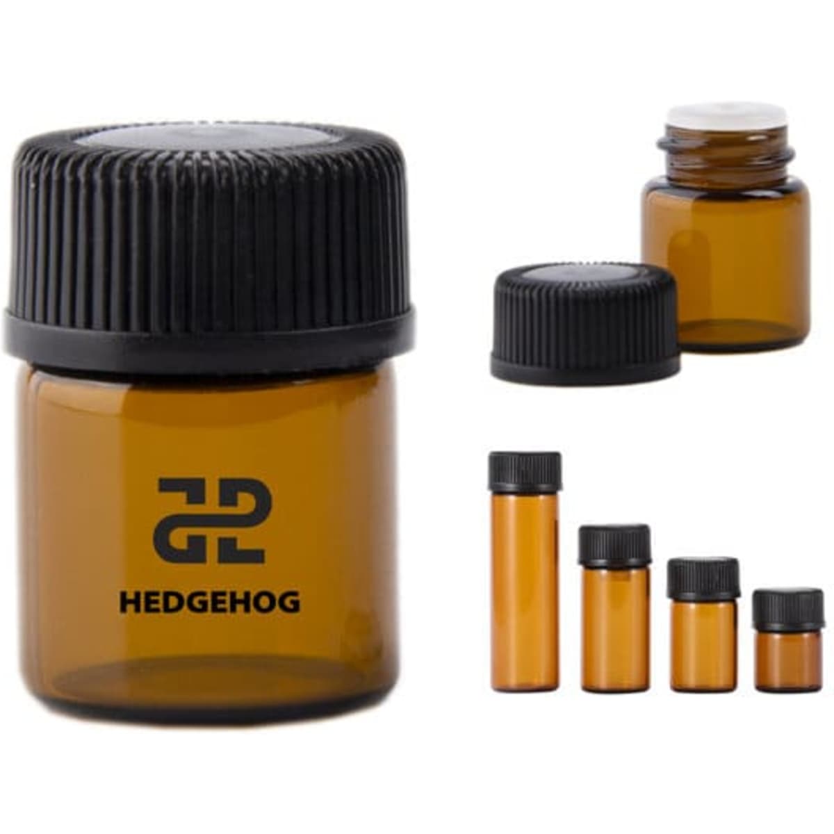A set of amber glass essential oil bottles with black lids, featuring a logo. Sizes vary from small to medium.