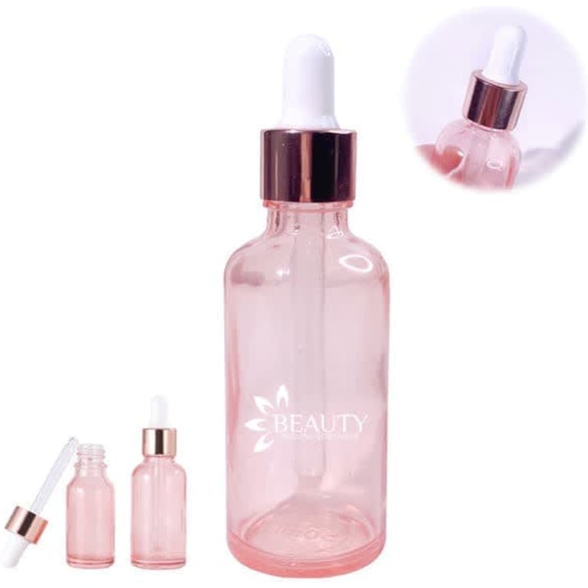 A 30ml rose gold and pink glass dropper bottle with a white pipette and a logo on the front.