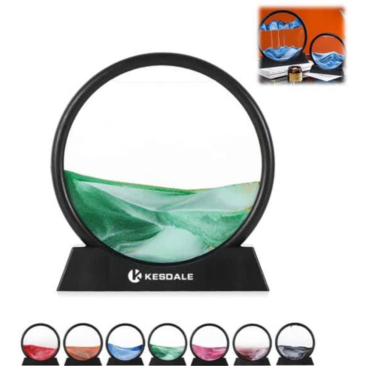 A circular, black-framed 3D quicksand painting with green and blue sand, displayed on a black base.