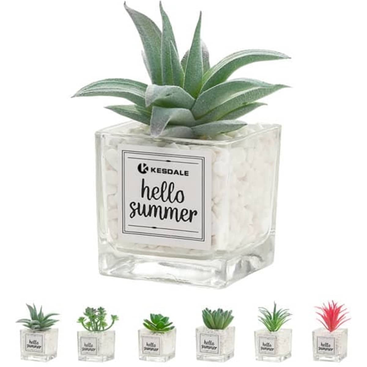 A mini artificial succulent plant in a clear glass pot with white stones, featuring green and pink leaves.
