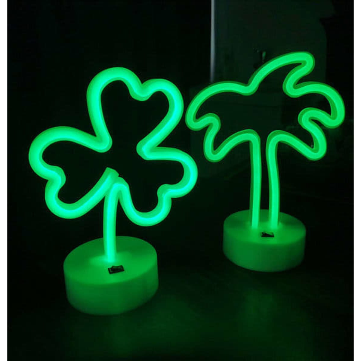 A green neon LED light sign featuring a clover shape and a palm tree, each on a white base.