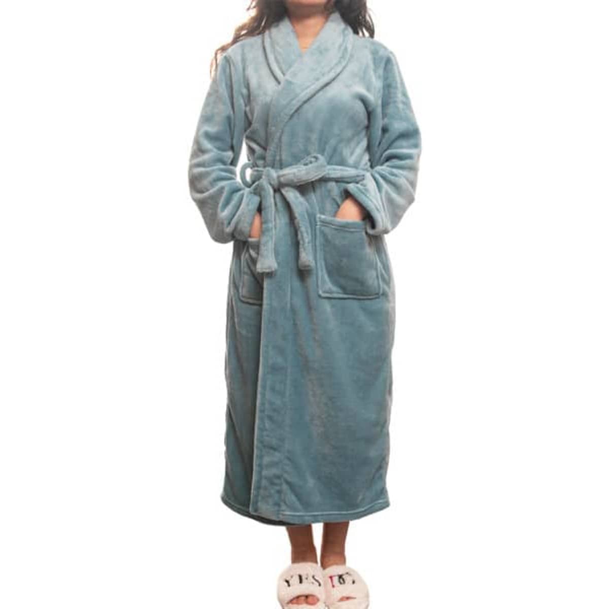 A soft blue lapel flannel bathrobe with pockets, worn by a model. Slippers are also visible.