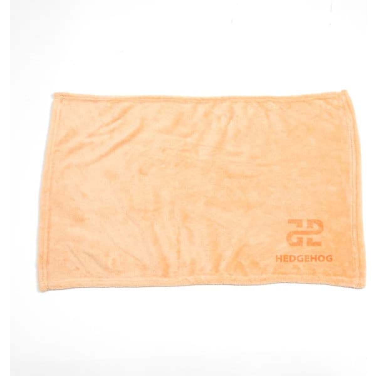 An orange flannel fleece blanket featuring a logo in the corner. Soft and plush texture.