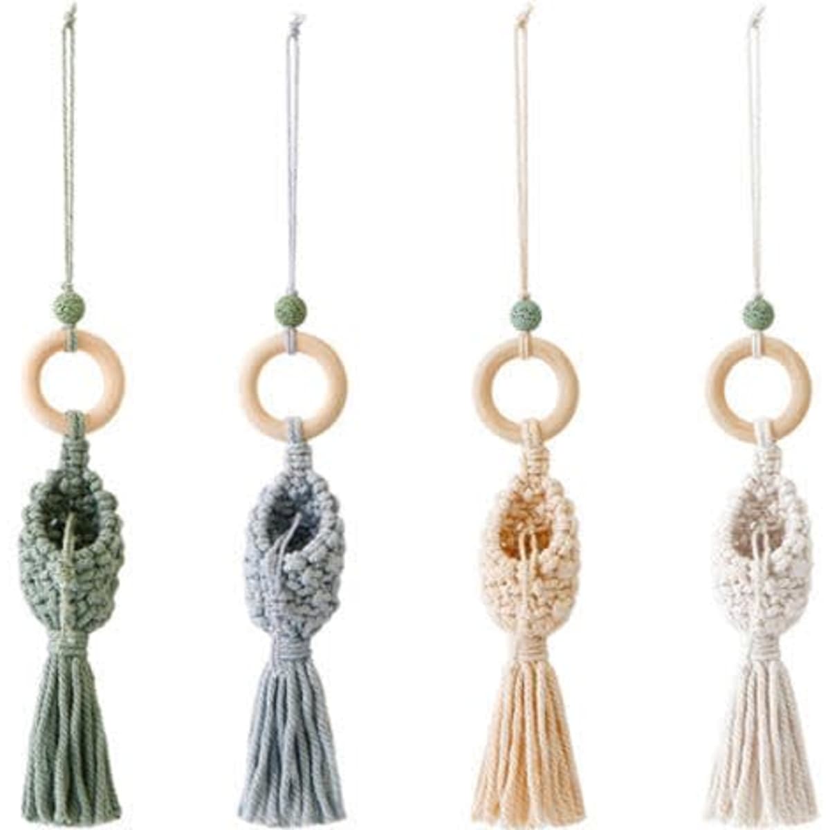 A set of four decorative perfume bottle pendants in pastel colours, featuring tassels and wooden rings.