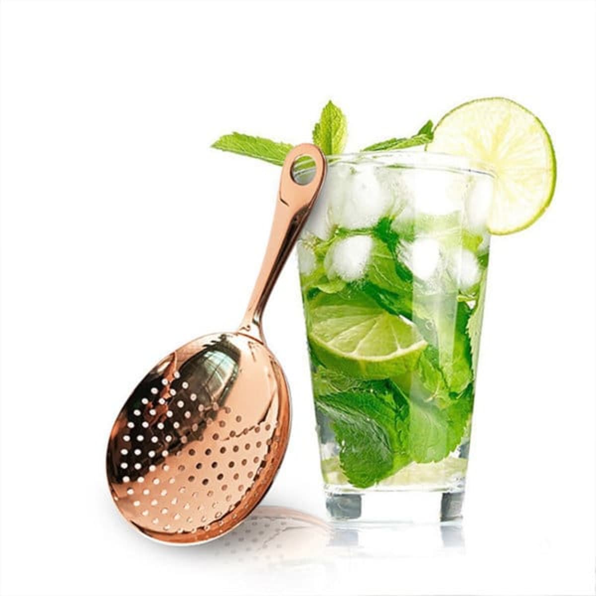 A copper cocktail strainer alongside a glass of mojito, featuring mint leaves, lime slices, and ice.