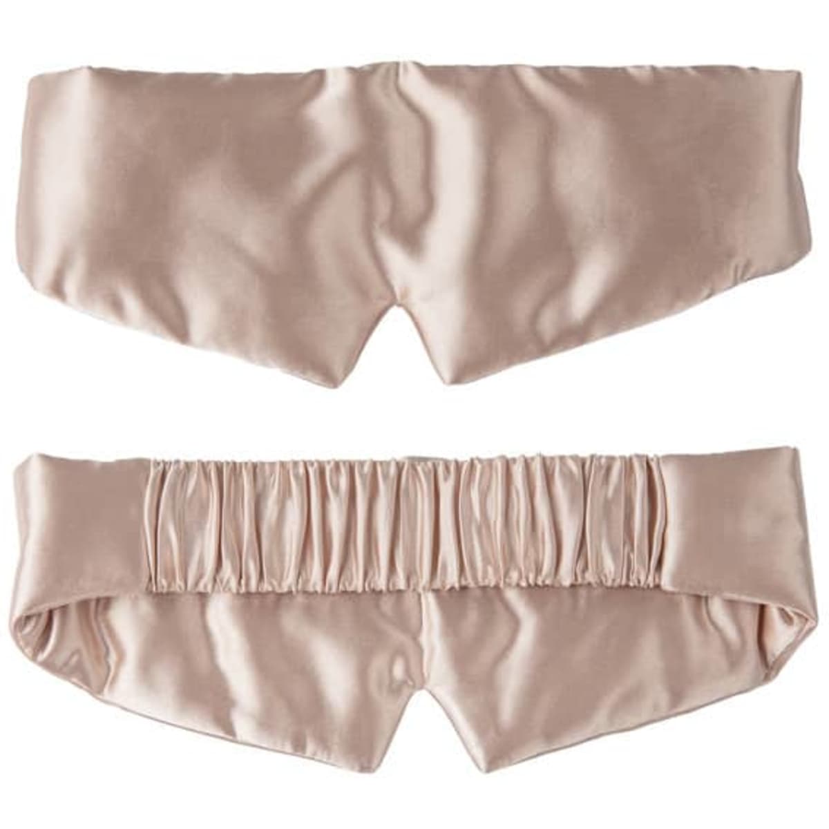A satin silk sleep mask in a soft pink hue with an elastic band at the back and a smooth finish.