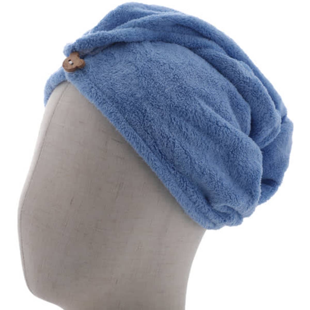 A blue coral fleece hair towel wrap displayed on a mannequin head, featuring a button detail.