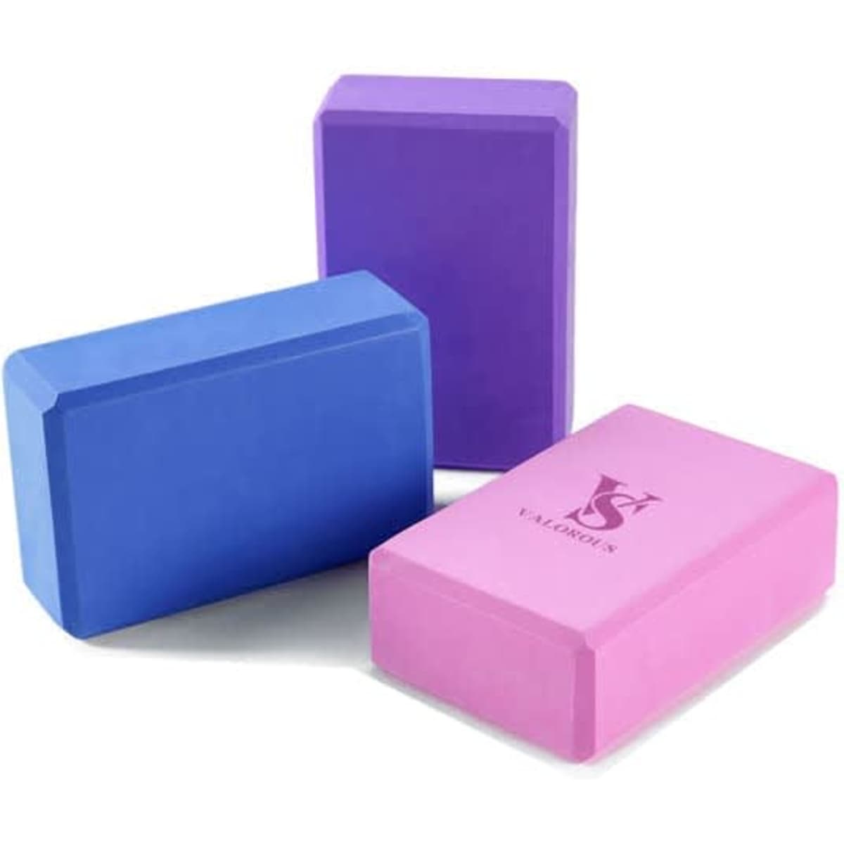 Three custom EVA foam yoga blocks in blue, purple, and pink. One block features a logo.