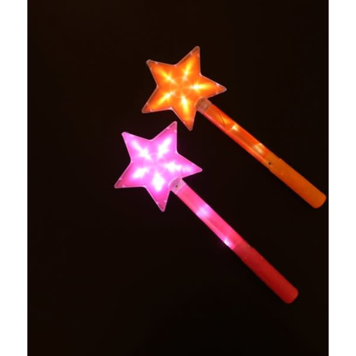 Two star-shaped light-up sticks, one orange and one pink, glowing with bright lights against a dark background.