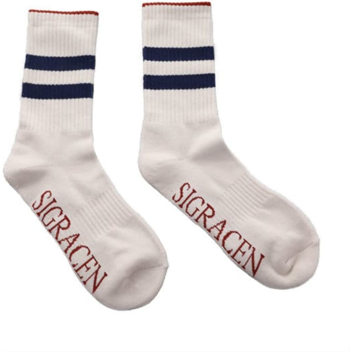 Striped tube crew socks in white with navy and red stripes, featuring branding on the soles.
