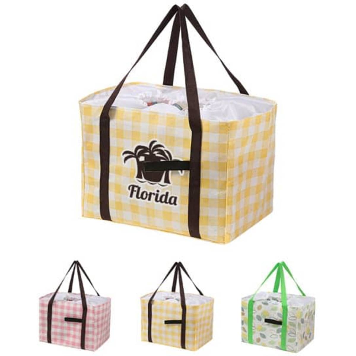 A foldable picnic bag in yellow gingham with brown straps, alongside pink, green, and patterned variations.