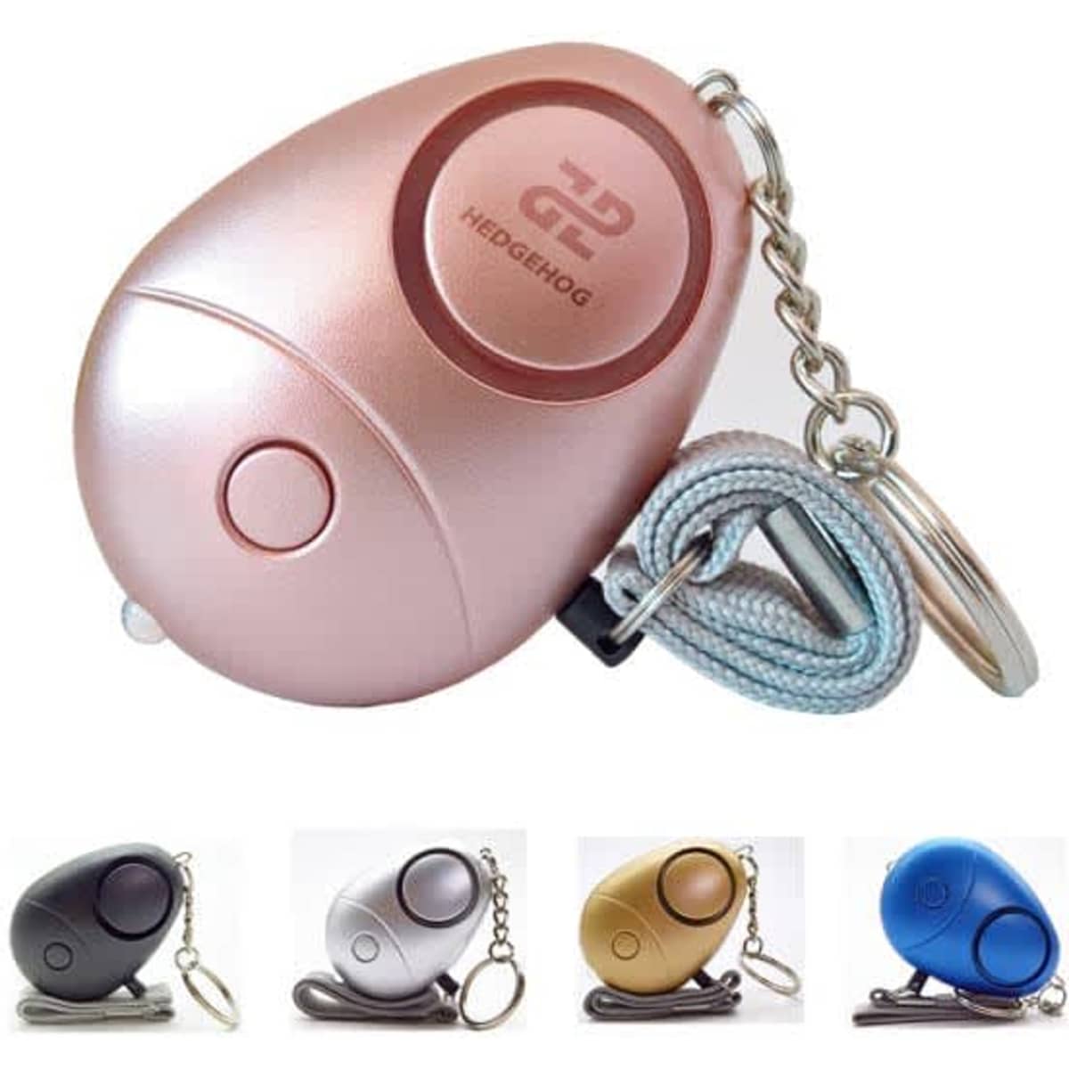 A pink personal security alarm keychain with LED light, accompanied by keychain options in black, silver, gold, and blue.