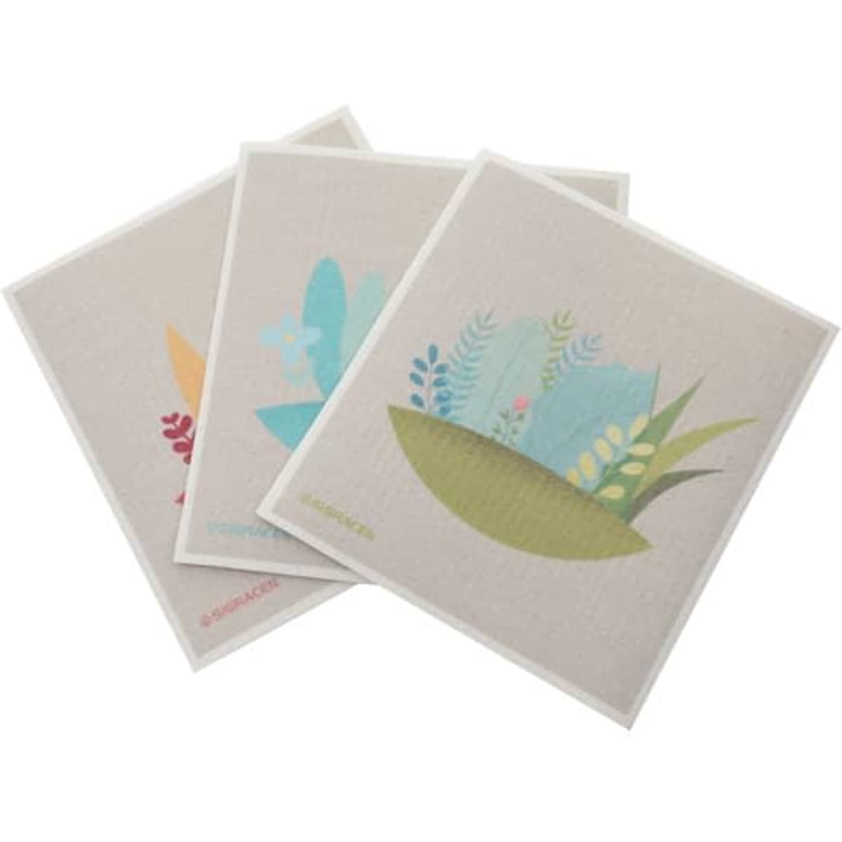 Three customised eco-friendly degradable dish cloths featuring floral designs in pastel colours on a light background.