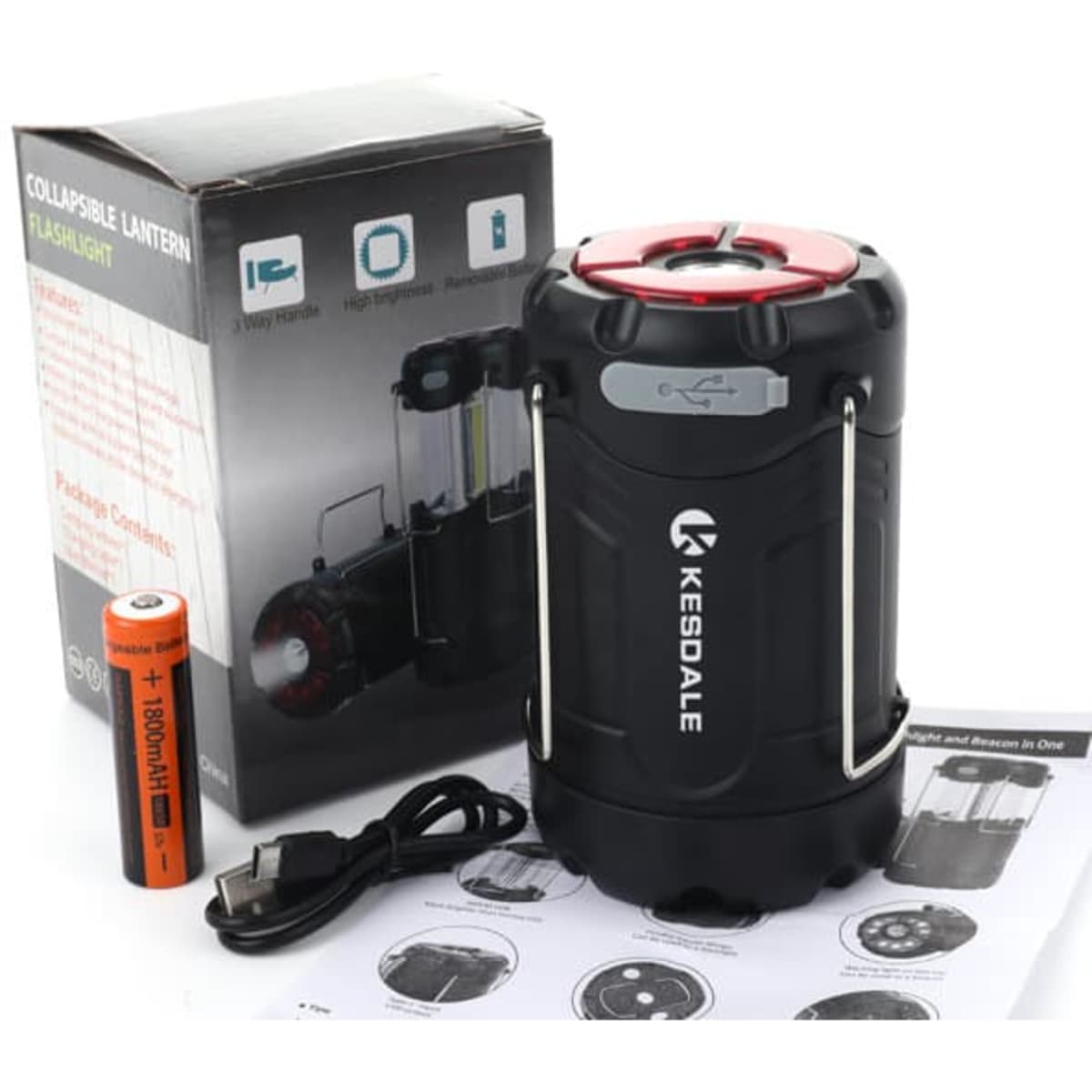 A collapsible camping lantern in black with red accents, alongside a battery and instruction manual. Contains a logo.