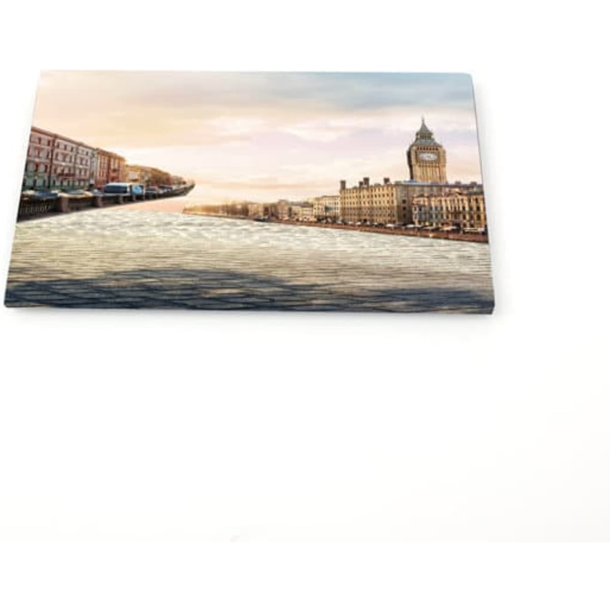A custom tinplate fridge magnet featuring a scenic view of a river and buildings, with soft pastel colours.