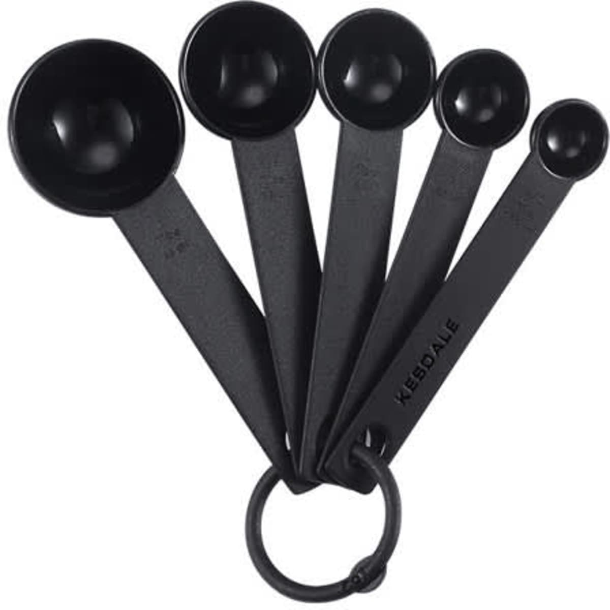 A set of five black plastic measuring spoons attached by a ring, featuring varying sizes for precise measurements.