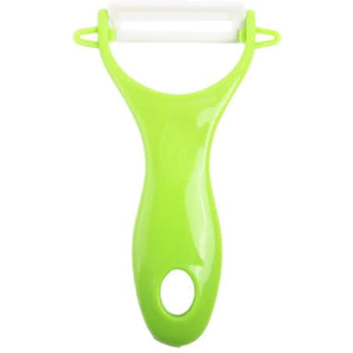 A green plastic household peeler with a white peeling blade, designed for kitchen use.