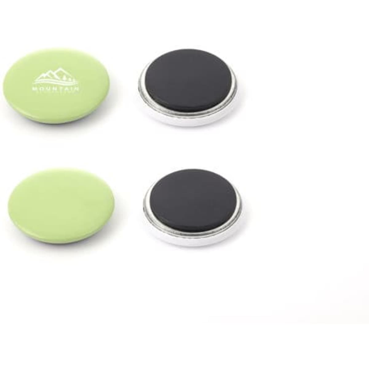 A set of round tinplate magnetic badges in green and black, featuring a logo on one badge.