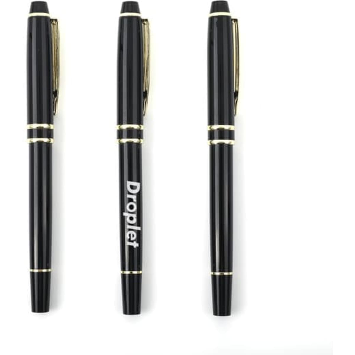 A set of three luxury custom stainless steel ballpoint pens in black with gold accents and a logo.