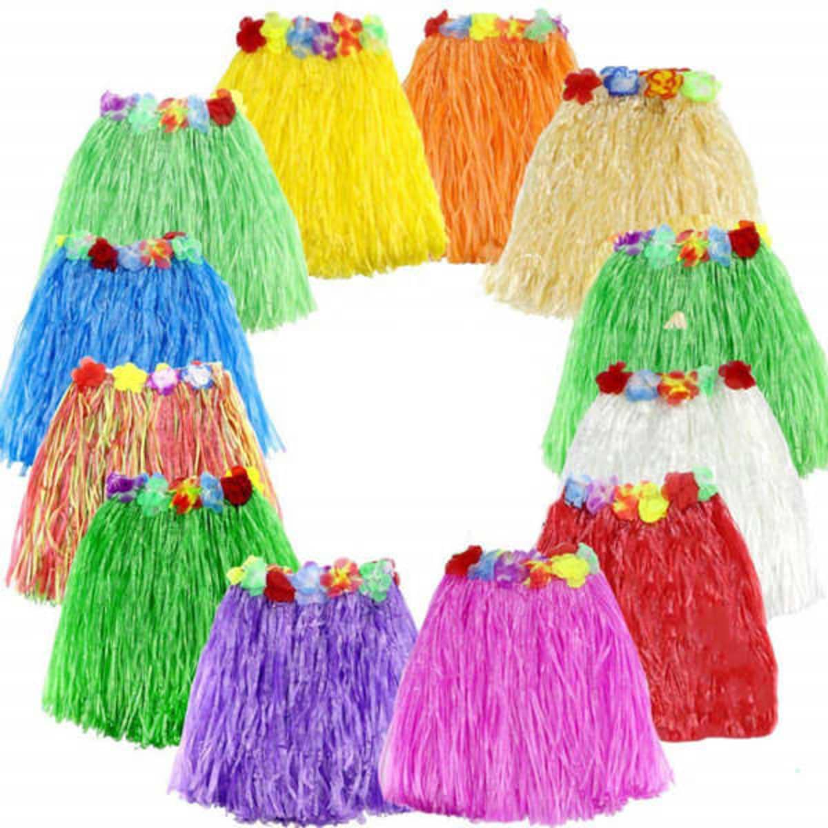 A circle of Hawaiian luau hula skirts in various vibrant colours, adorned with floral decorations. Each skirt has a different hue.