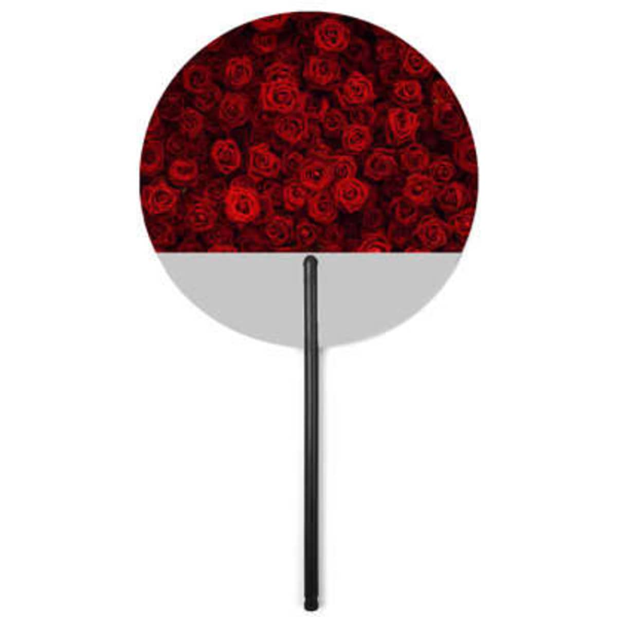 A round fan featuring a design of red roses with a black handle. It has a white lower section and a logo.