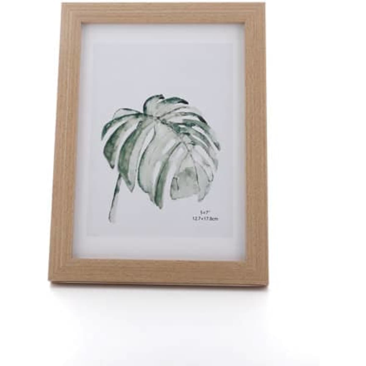 A personalised 7-inch photo frame in natural wood, displaying a botanical print of a leaf.