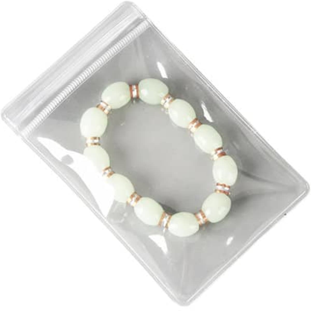 A clear PVC jewellery seal bag containing a pale green bracelet with metal accents. The bag has a ziplock closure.