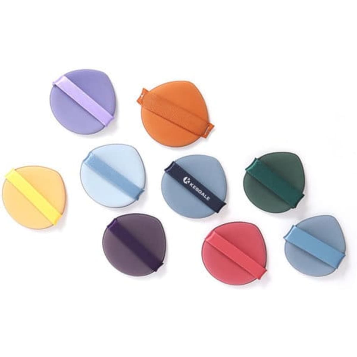 A collection of double-sided air cushion puffs in various colours, including purple, orange, green, and blue, with a logo.